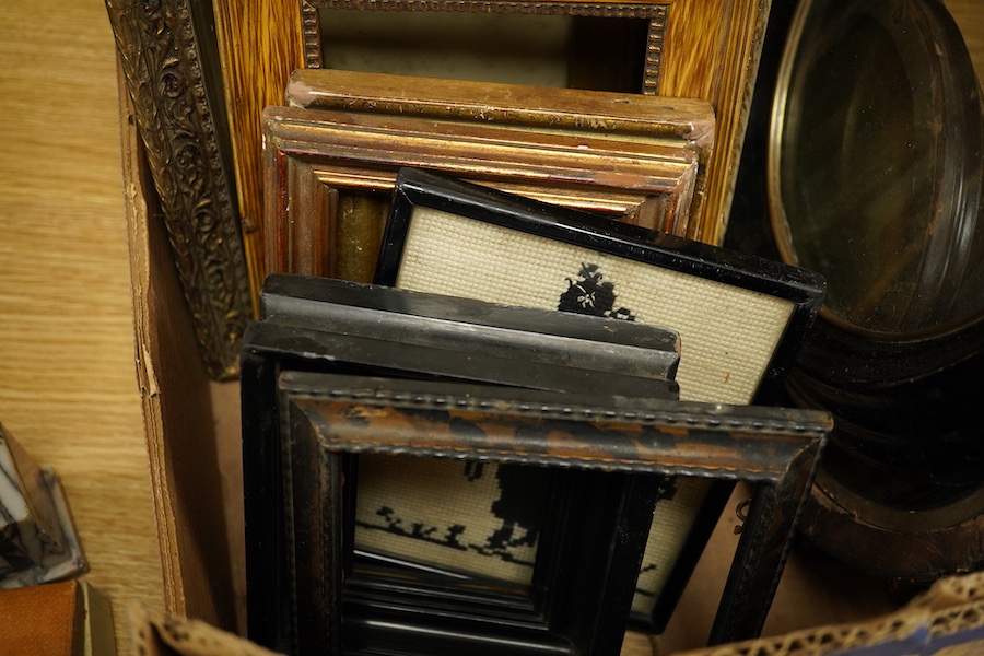 A box of variously-sized rectangular and oval picture frames, largest 29cm high x 24cm wide